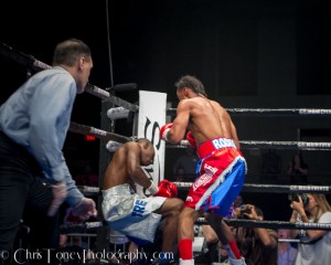Rodriguez (R). watches as Wiggins sinks to the canvas.