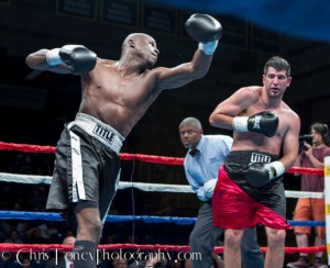 Goyco (L.) launching the left hook.