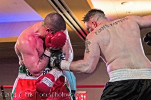 Caputo (R.) drilling the left uppercut to the body.