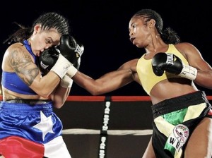 Ashley (R.) rips Christina Ruiz with a right uppercut. (Photo Sue Johnson)