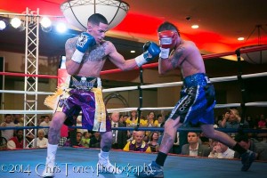 Cartagena (L.) landing the left hook on Robles.