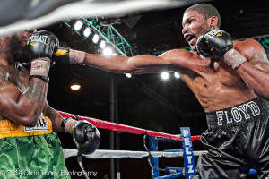 Floyd (R.) using his long right jab.