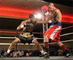 Fulton (L.) jabbing to the body. (Photo by John DiSanto)