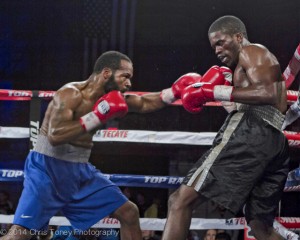 Jenkins (L.) attacking Robinson on the ropes.