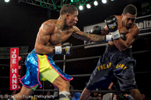 Smith (L.) punishes Jackson on the ropes.